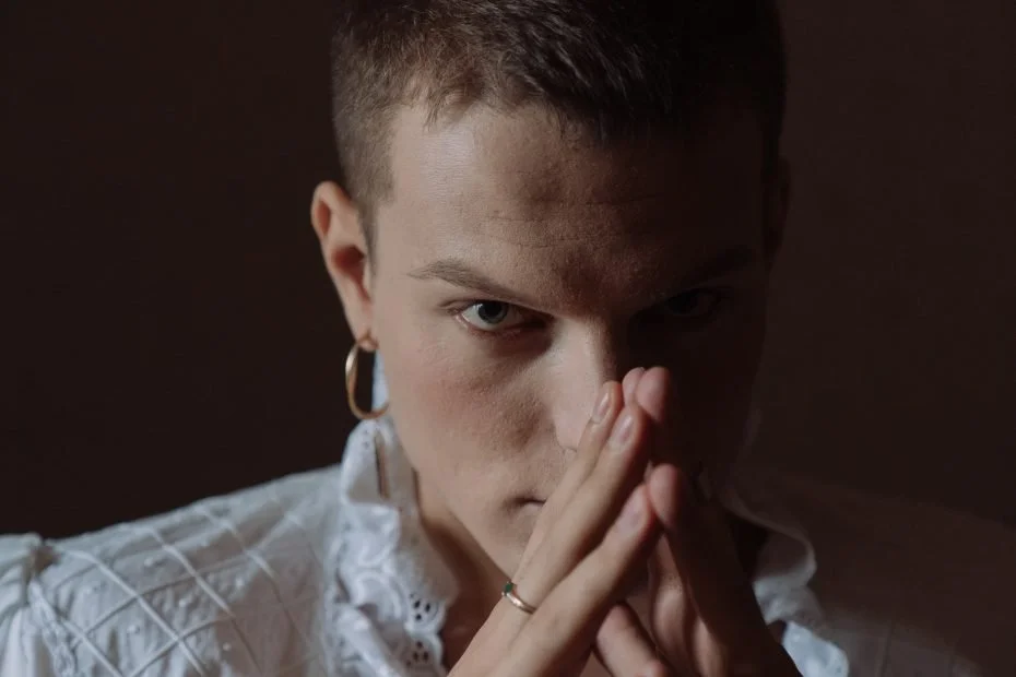 Man looking evil steepling his fingers together