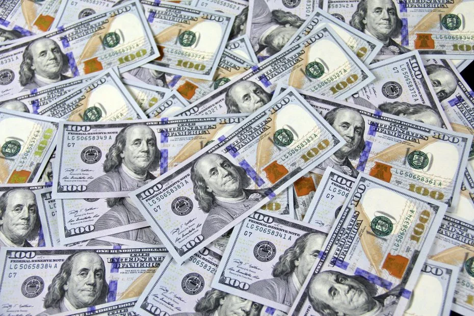 Many hundred dollar bills